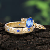 Nature-Inspired Branch-Wrapped 4-Prong Oval Sapphire Engagement Couple Rings